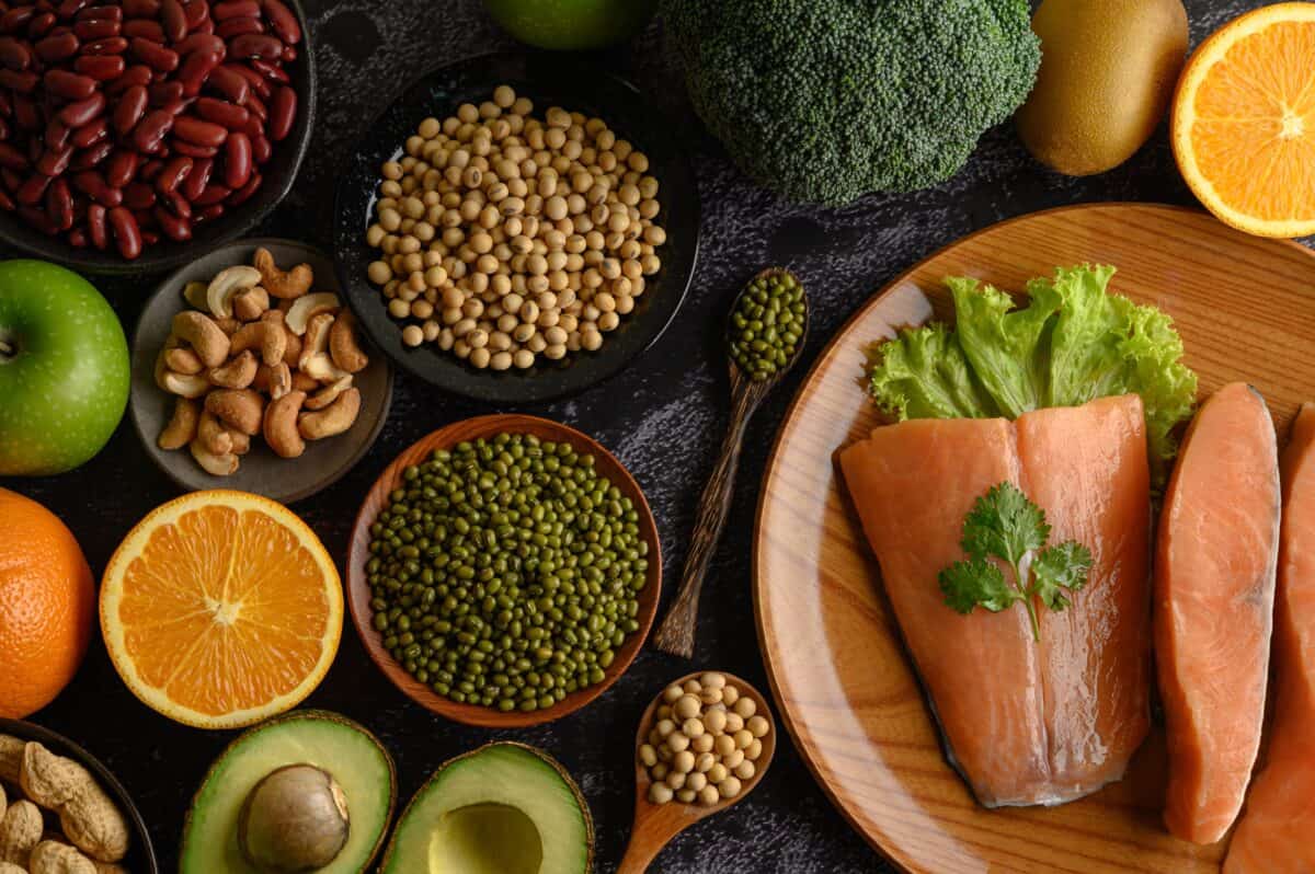legumes fruit salmon pieces wooden plate